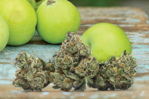 Green apples on wooden table.